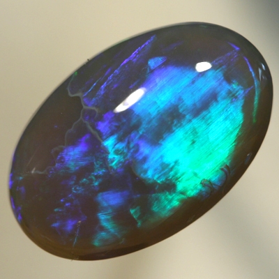 SOLID BLACK CRYSTAL OPAL Two large rolling flashes, green and turquoise shades SEE VIDEO